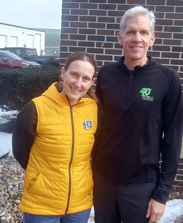 Dani Bohn, the new director of the Brookings Marathon, poses with Matt Bien, who directed the race for 17 years. Bien has guided the transition, but will step away for the 55th running of the third oldest continually run marathon in the nation. The marathon, which started in 1970, will use the theme “Staying Alive at 55” for this year’s event, which is May 11.