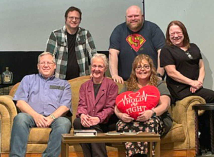Cast members of the Huron Area Community Theatre’s production of “The Tin Woman,” are, seated from left: Leo Jensen, Diane Clayton, Kristy Hubbard and Melanie Letsche. Standing in the back are Kenneth Peterson and Benjamin Chase. Not picture is Sydnee Winter.
