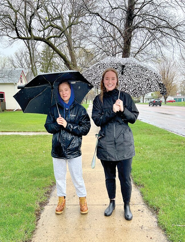 While many stayed inside or hustled between destinations and their vehicles this past weekend, Abigail Meyers and Elaina Fricke enjoyed a leisurely stroll as the rain poured down on Sunday. Rain and cooler temperatures remain in the extended forecast as the calendar flips over into the month of May.