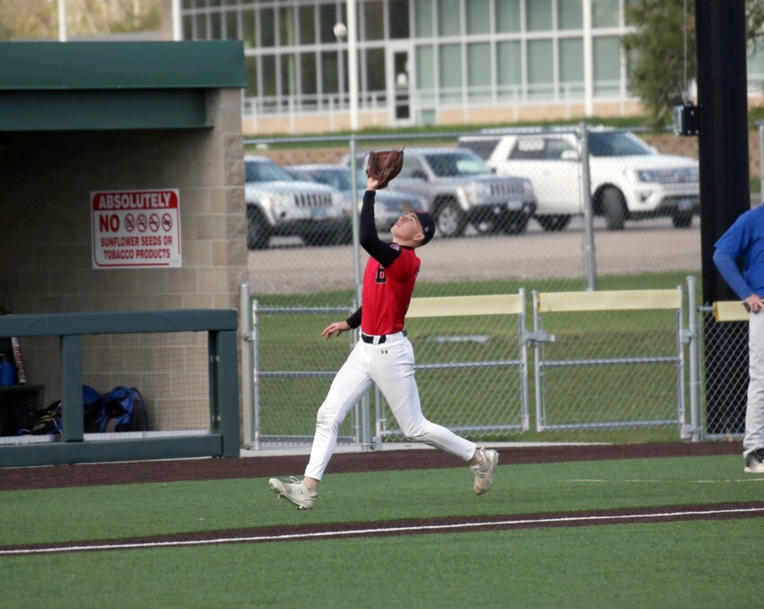 Brookings’ David Brink tracks down a pop-up during a doubleheader against O’Gorman at Bob Shelden Field in Brookings on Tuesday evening. The Bobcats lost both games.