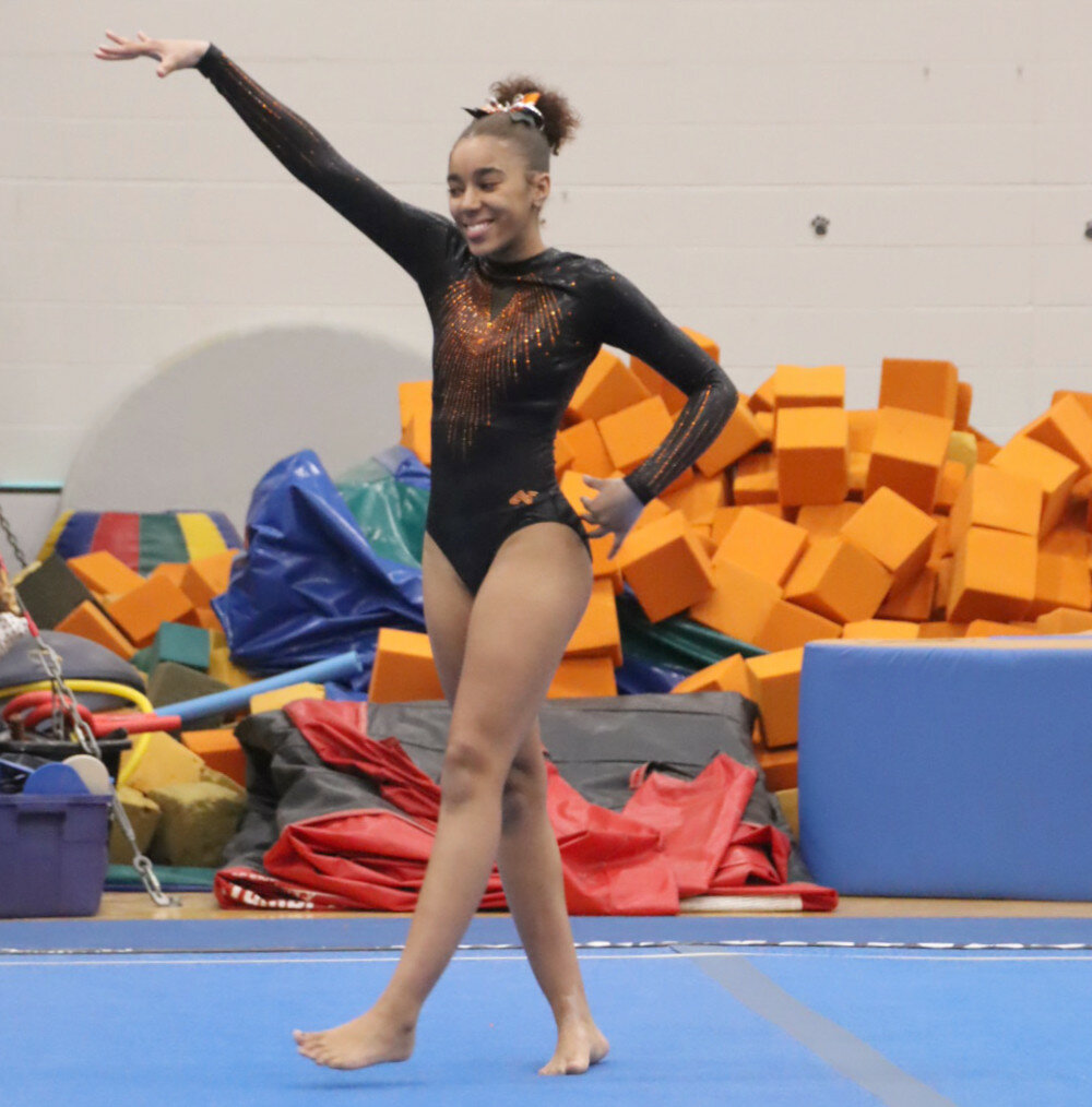 Photos by Benjamin Chase/Plainsman
Tathiana Capers strikes a pose during her Floor Exercise routine.