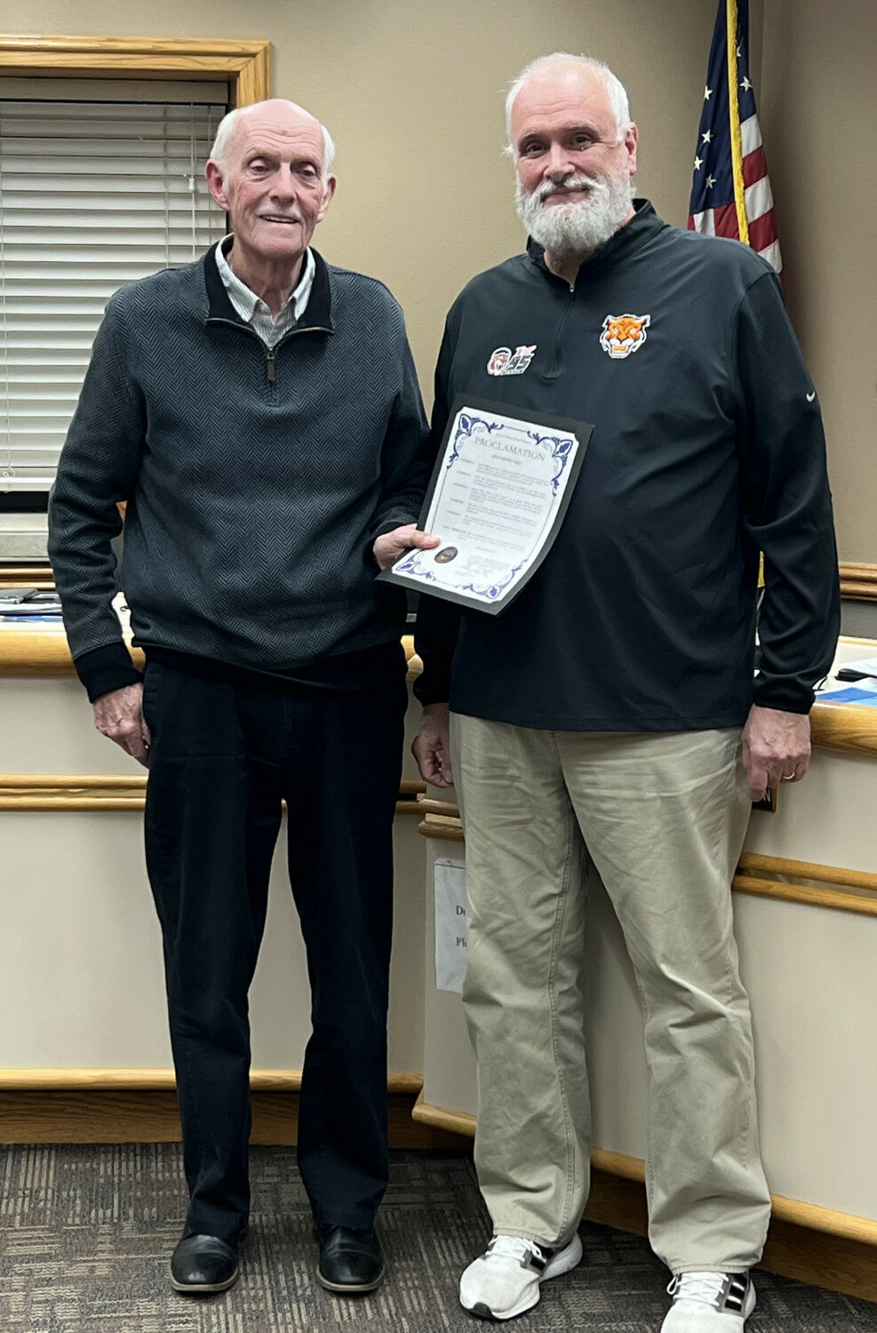 BENJAMIN CHASE / PLAINSMAN
Mayor Gary Harrington, left, recognized radio broadcaster Jeff Duffy for 40 years with the radio station and 22 years doing sports broadcasts for the Huron Tigers by declaring Tuesday, Nov. 28, as Jeff Duffy Day in Huron.