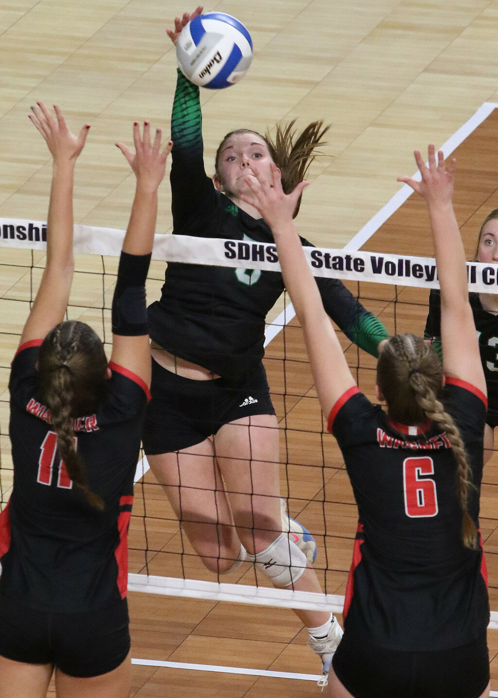 COURTESY OF SDPB
Miller’s Paige Werdel spikes the ball during Thursday’s match at the Class A State Volleyball Tournament in Summit Arena at the Monument in Rapid City.