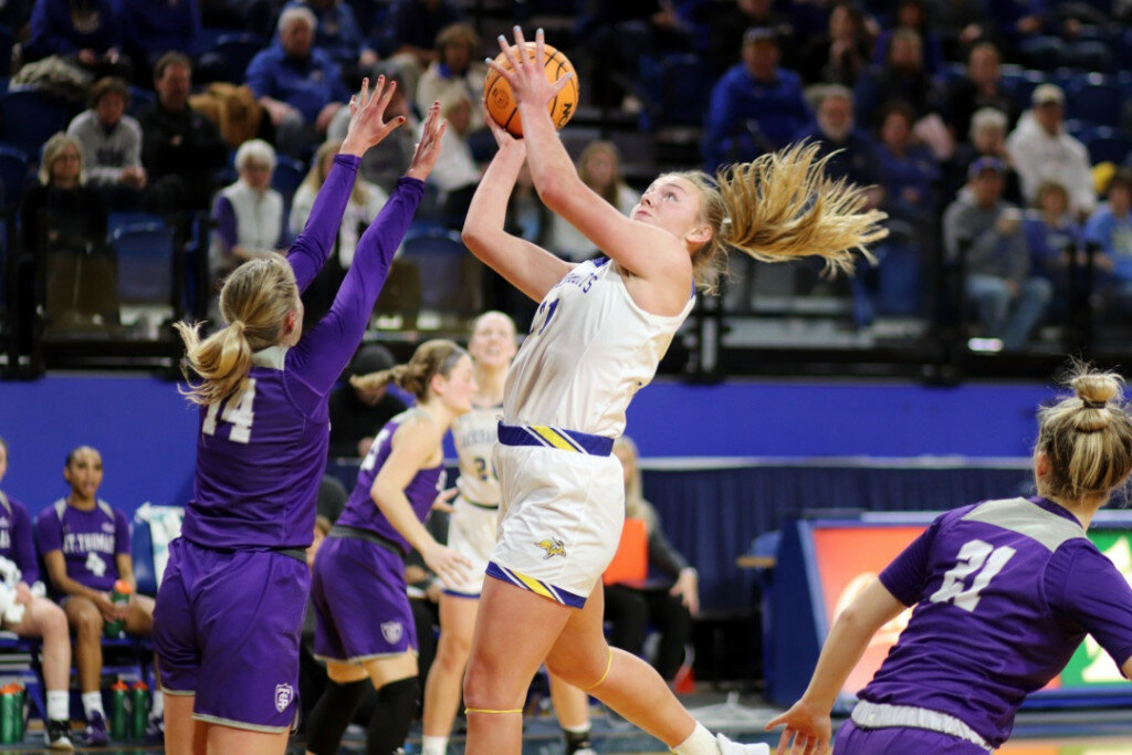 (Andrew Holtan/Register) South Dakota State's Brooklyn Meyer goes up for a shot during a 99-57 win over St. Thomas on Thursday night at Frost Arena in Brookings.