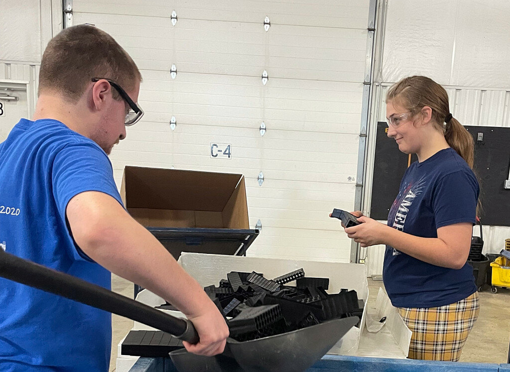 Workers who were helped getting jobs through Project SEARCH are seen on the job at Falcon Plastics in Brookings. The program is a combined effort and tailored toward young adults with disabilities.