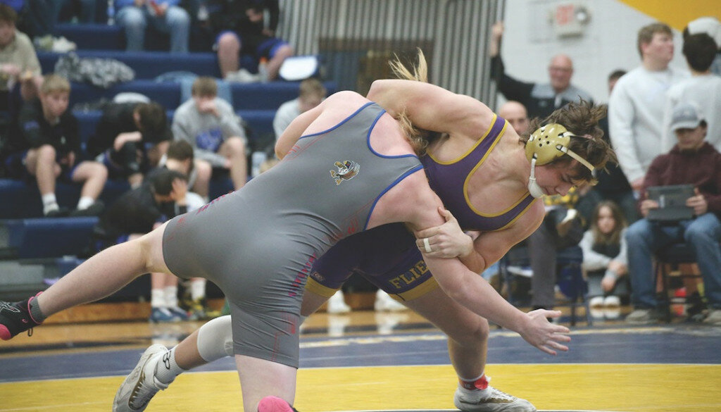 Flandreau’s Karter Headrick takes Parker’s Jake Stone to the mat during a 190-pound quarterfinal match at the Big East/LCC Tournament at the Cossack Center in Volga on Saturday afternoon. Headrick won all four of his matches by pinfall on the way to the 190-pound title. (Chris Schad / Register)