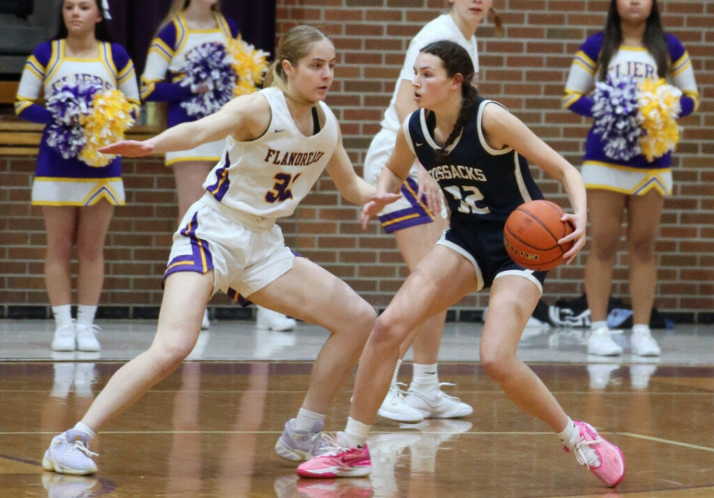 Flandreau’s Claire Sheppard guards Sioux Valley’s Kailey Cradduck during a 49-37 Flandreau victory on Friday night in Flandreau. The Fliers improved to 15-0 as they also beat Centerville on Saturday at the Corn Palace in Mitchell. (Chris Schad/Brookings Register)