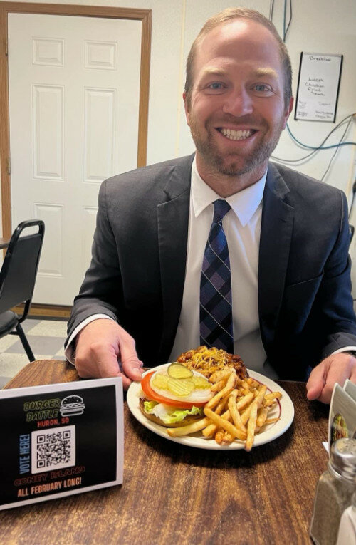 Courtesy photo
Huron Connect member Jacob Lindgren gets ready to dig into one of the Burger Battle entrants.