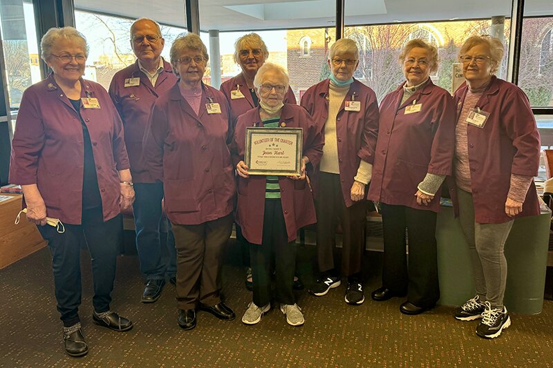 Photo Courtesy HRMC
Jean Hart, HRMC Auxiliary volunteer, poses for a photo following her acceptance of the Volunteer of the Quarter award with HRMC team members, fellow Auxiliary volunteers and family members.