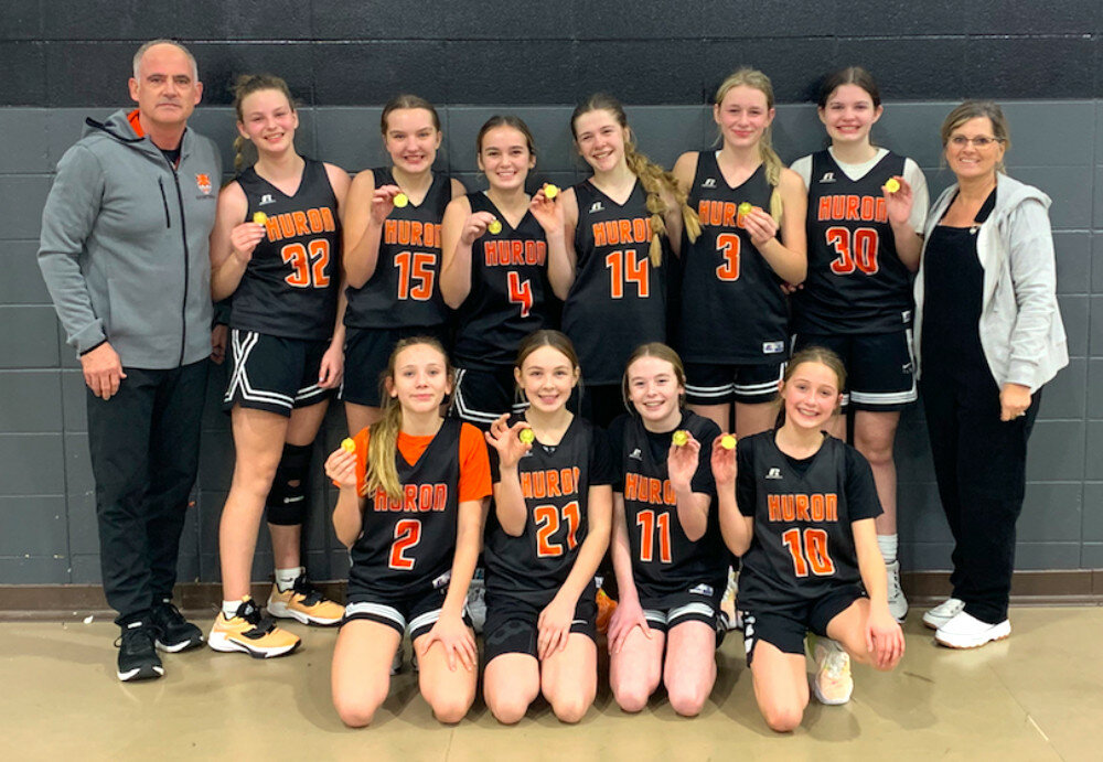 CONTRIBUTED
The Huron seventh-grade girls’ basketball team won the B-g 4 Tournament on Tuesday. Front row, from left: Autumn Siedschlag, Carli Winegar, Cora Wilk and Tally Hins. Back row: coach Chris Rozell, Arian Pfitzer, Laney Marshall, Jesse Mattke, Ramsey Rozell, Jayla Schley, Madison Metzger and coach Lisa Kissner.