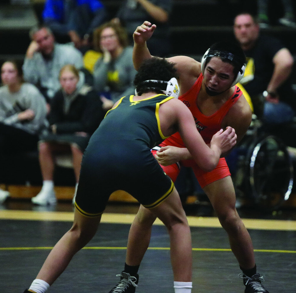 PHOTOS COURTESY OF JOEL BERGESON
Huron’s Lah Doh Soe wrestles Samari Wright of Mitchell in a 144-pound match Thursday at Mitchell High School.