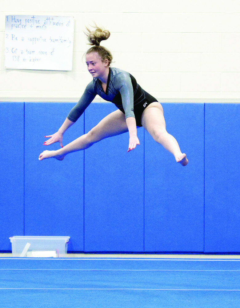 Photos by John Davis/sdsportscene
Huron’s Alivia Cunard leaps in the air during her floor exercise routine Saturday at the Hub City Invitational gymnastics meet at Aberdeen Central High School.