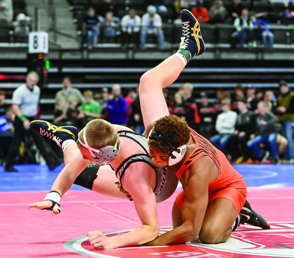 MATT GADE/RAPID CITY JOURNAL
Philip Area’s Jace Blasius, left, and Huron’s Moses Gross wrestle in the 150-pound championship match the Rapid City Invitational on Saturday at Summit Arena at The Monument.