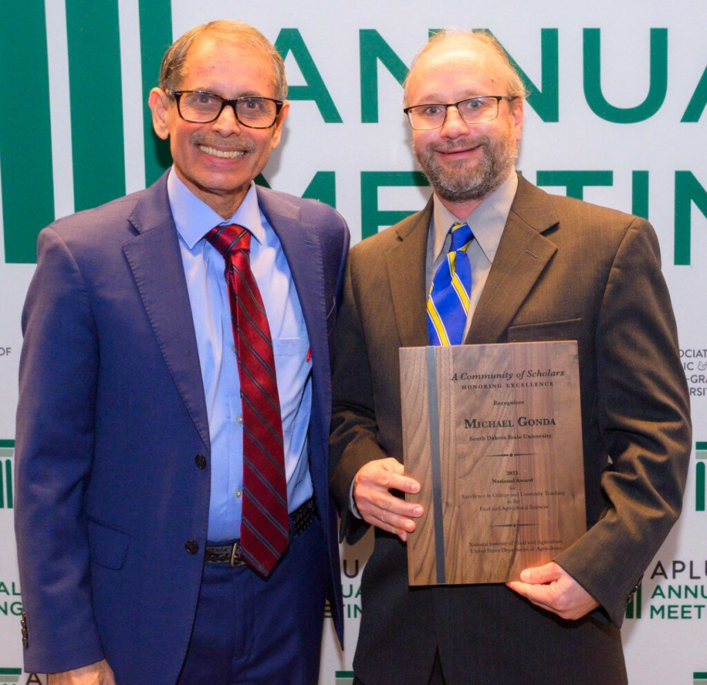 Michael Gonda, a professor in South Dakota State University's Department of Animal Science, has been awarded the U.S. Department of Agriculture National Institute of Food and Agriculture’s National Award for Excellence in college and university teaching in food and agricultural sciences for 2023. Pictured above, Gonda, right, with Manjit K. Misra, director of the USDA National Institute of Food and Agriculture. (Photo via APLU and Nick Klein Photography)