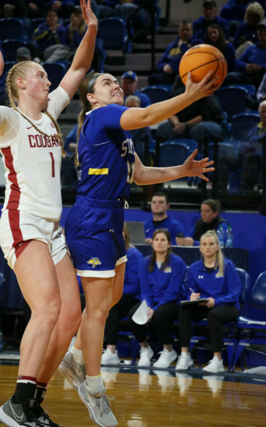 Jackrabbits guard Paige Meyer goes for a layup during the fourth quarter of a game against Washington State at Frost Arena in Brookings on Tuesday night. (Andrew Holtan/Brookings Register)