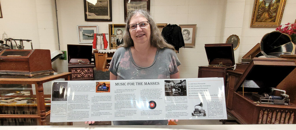Executive Director Louise Van Poll displays a new reading rail panel she designed for the Dakotaland Museum. Developing new exhibits and activities were part of the courses she took to complete the Small Museum Pro! Certification.