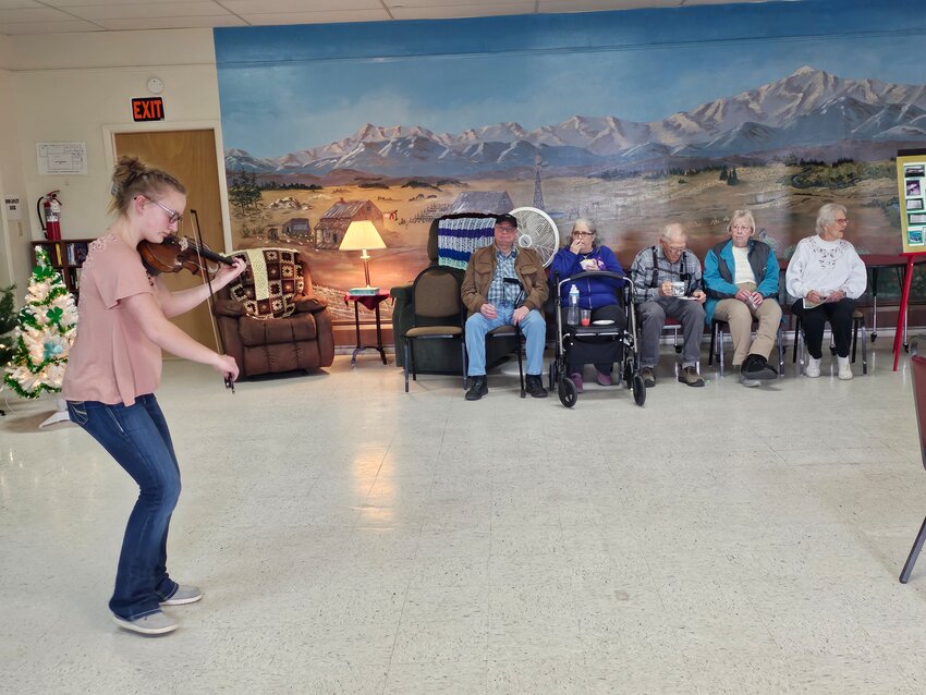 Wheatland violinist Elaina Haroldson entertained with both classical violin and fiddle arrangements during the Services for Seniors 50th Anniversary party held at the Activity Center.