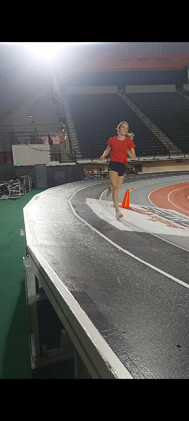 Jason ZumBrunnen/for the Lusk Herald
NCHS senior Melody ZumBrunnen, pictured running a warmup lap, participated in the prestigious Simplot Games at the Idaho State University’s ICCU Dome in Pocatello. ZumBrunnen competed in both the long jump and triple jump at the 2024 Simplot Games.