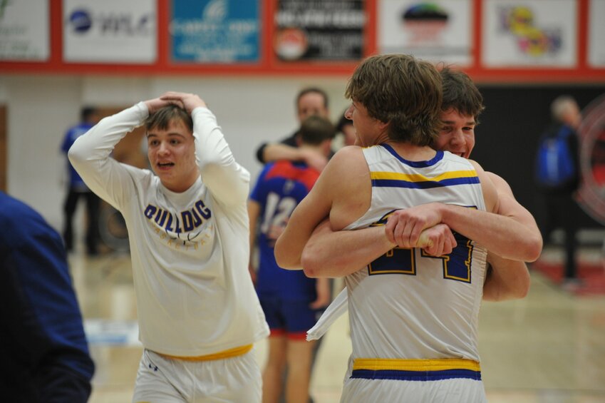 Senior Brock Peasley and junior Jacob Hyche hug it out after upsetting the #1 ranked Douglas Bearcats in State Champion semifinal game.