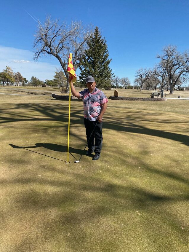 Andy Espinoza soaking up the warm March sunshine at Cottonwood Golf Course, in Torrington. Espinoza landed a hole-in-one on hole nine of the course.