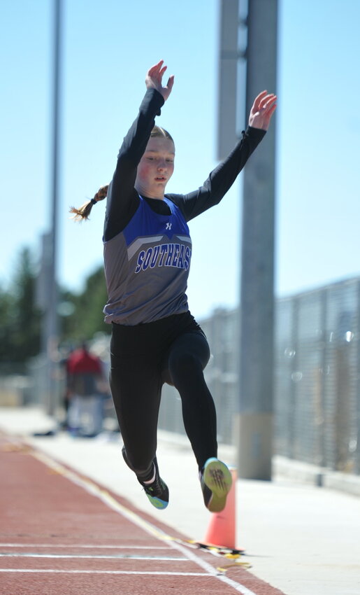 Freshman Bailey Mehling catches air in the triple jump. Mehling captured second place in the event.