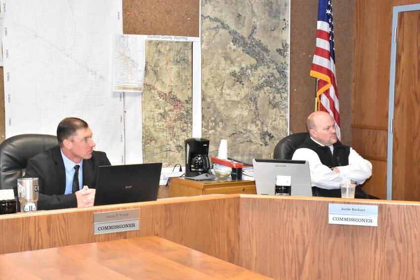 County Commissioners, Aaron P. Walsh (left), and Justin Burkart (right), amicably discuss ideas, events, and concerns with the public and commissioner McNamee Tuesday morning.