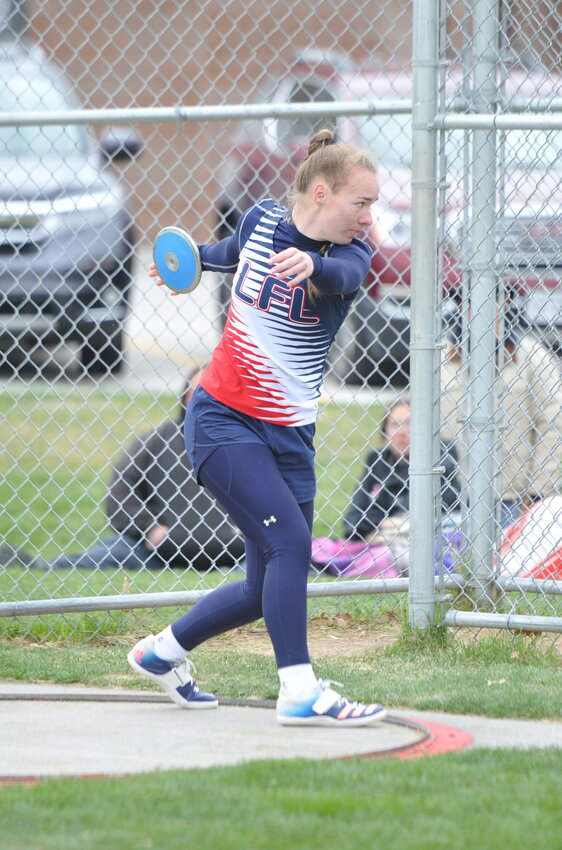 Senior Izzy Spears launches the discus at Scottsbluff on Friday. Spears snagged gold in the event.