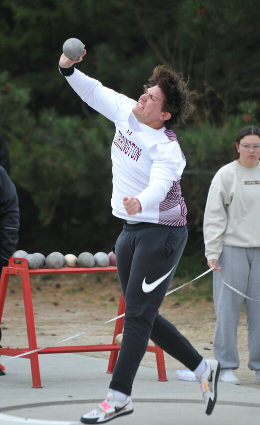 Senior Tyler Bennick launches the shot put at the Scottsbluff Twilight. Bennick garnered gold in both the shot put and discus.