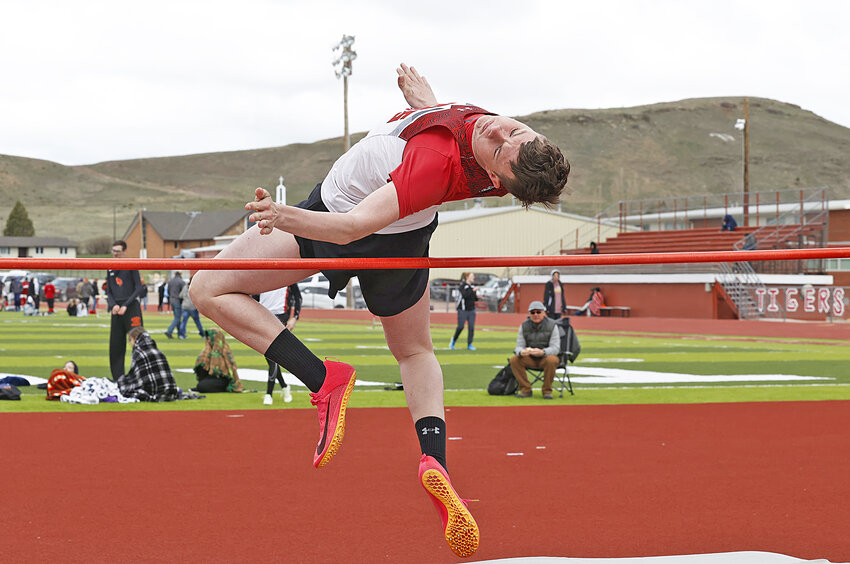Sophomore Charlie Gaukel clears the bar in the high jump at the Dennis Zowada Invite in Lusk on April 26. Gaukel placed fifth in the event with a mark of 5-02.