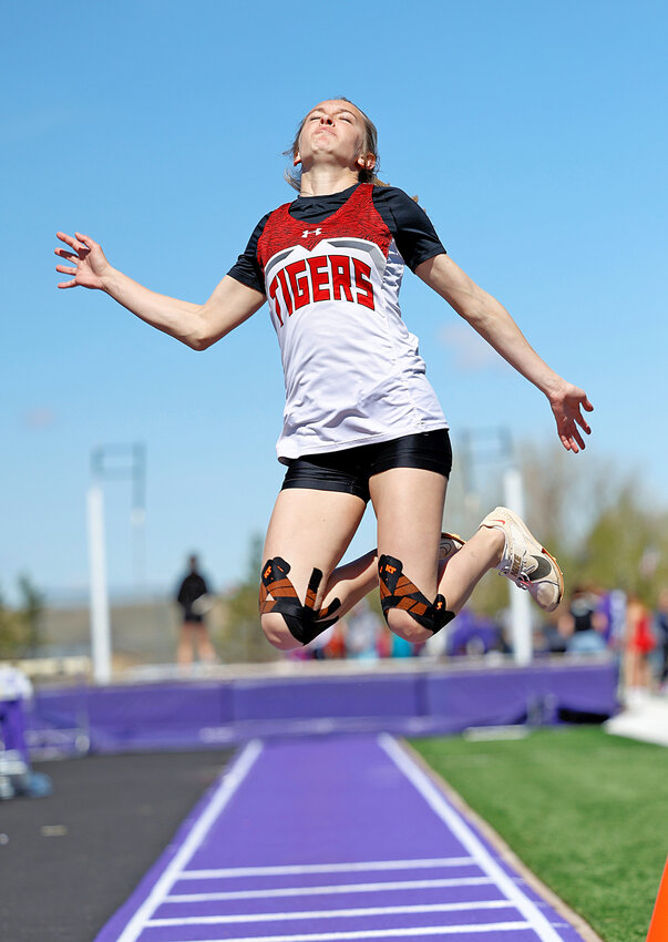 Senior Melody ZumBrunnen catches air in the long jump. ZumBrunnen went on to win the event, along with the 100-, 200- and 400-meters at SEWAC in Glenrock on May 4.
