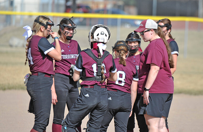 The Torrington Lady Blazers fielders huddle with assistant coach Jade Reinhardt in March. The team concluded its spring season with a double-header against Cheyenne on May 10.