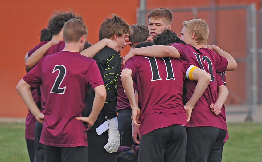 The Torrington High School Blazers, in a pregam huddle before the Worland home game on April 12, captured the No. 1 berth for the upcoming state tournament this weekend.