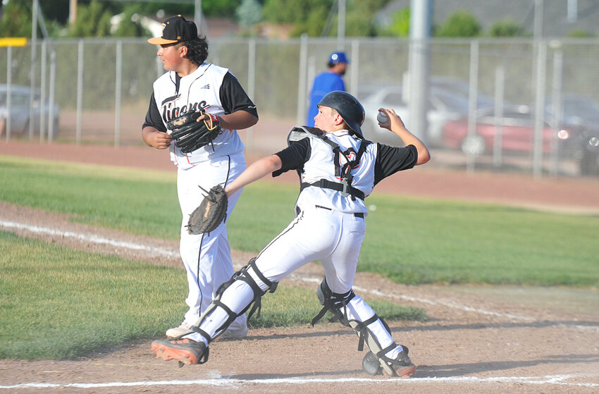 A tenacious defense by the Tigers ‘C’ team resulted in a split double-header game against Douglas on Tuesday. In the photo above, the Tigers’ catcher Colby Groene fields the ball as pitcher Kane Correa scans the field.