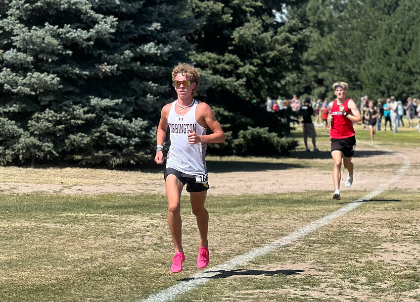 Junior Sullivan Wilson widens his lead at the front of the pack at the Kimball cross-country meet on September 13. Wilson snagged gold at the event with a time of 18:06.46.