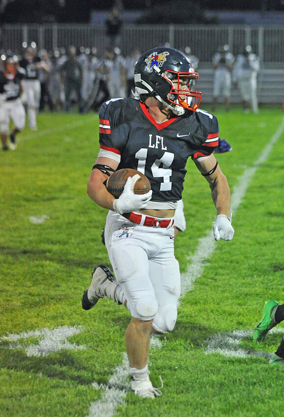 Senior Louden Bremer sprints toward the end zone against Wind River on September 7. Bremer scored two touchdowns  for the Doggers against Niobrara County on September 13.