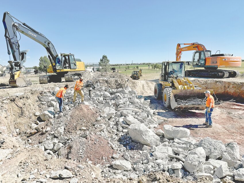 The base of the former Black Mountain water tower that was brought down earlier this month is being removed by contractor Alexander Construction, a Wheatland-based construction business. They are on track to have all debris removed from the demolition, and the ground stabilized by the end of this month as spelled out in their contract with the Town of Wheatland.