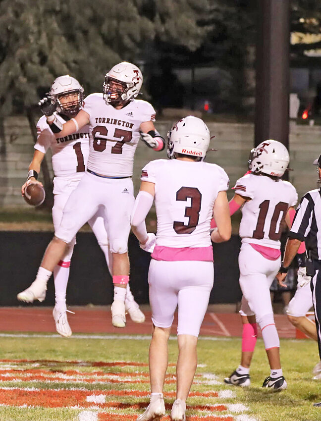 Senior Blazers quarterback Ryan Moorehouse, far left, celebrates running in Torrington’s first touchdown against Rawlins on October 4. Also pictured is senior Brayden Hime, No. 67, senior Mac Hibben, No. 3, and junior Landre Greiman, No. 1o.