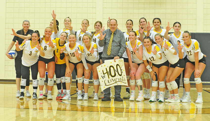 EWC head volleyball coach George Hamilton, center, and the Lady Lancers celebrate Hamilton’s 400th career win following EWC’s victory against Central Wyoming College on October 5.