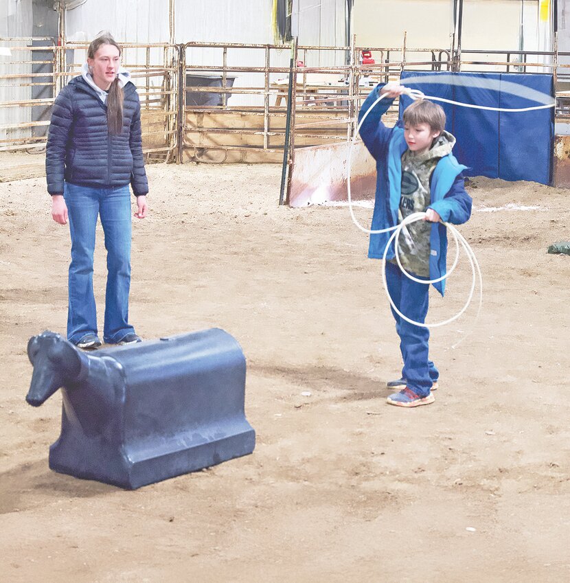 Madi McIntosh of Wheatland FFA coaches the roping station.