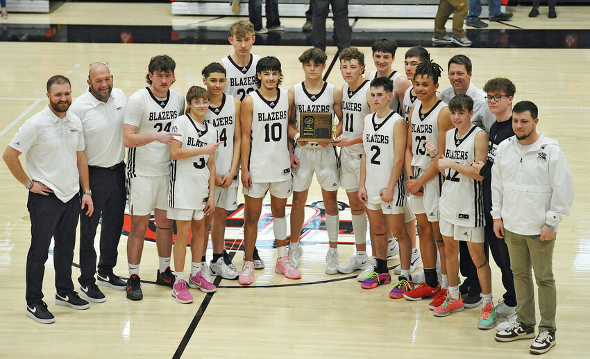 The Torrington High School Blazers captured third place at the 3A state tournament in Casper following a decisive win against Wheatland on Saturday, March 15. Pictured, from left, are head coach Logan Barker, assistant coach Shane Hime, Brayden Hime, Hayden Barth, Evan Munoz, Kaleb Booth (in back), Landre Greiman, Drew Kramer, Ryan Moorehouse, Weston Dyer, Mac Hibben (in back), Carter Groene (in back), Julian Stromski, assistant coach Jeff Ryall (in back), Gabe Jackson, Holden Hackett (in back) and assistant coach Bo Moorehouse.