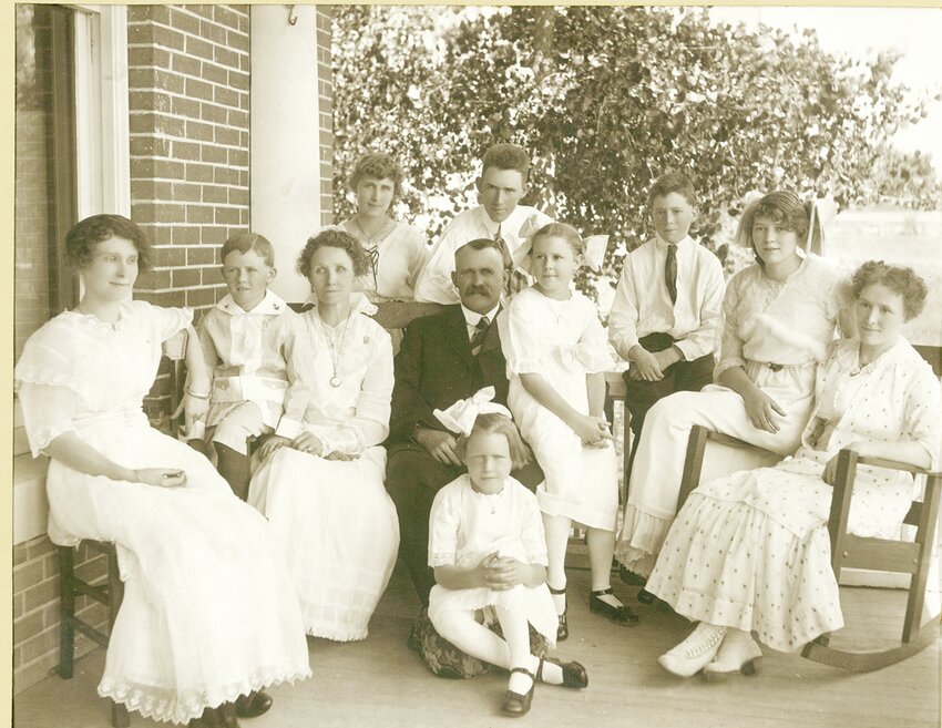 The Marvin L. Bishop family sat for this photograph on the porch of their home which was built in 1907. The history of the Bishops as it relates to the development of Casper, Wyoming will be presented by Susan Bishop on Tuesday, April 22nd at the Platte County Library beginning at 7 p.m.