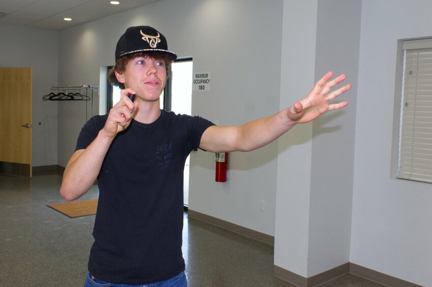 Lucas Ingram, a student of Logan and Jeremy’s, demonstrates the application of pepper spray.