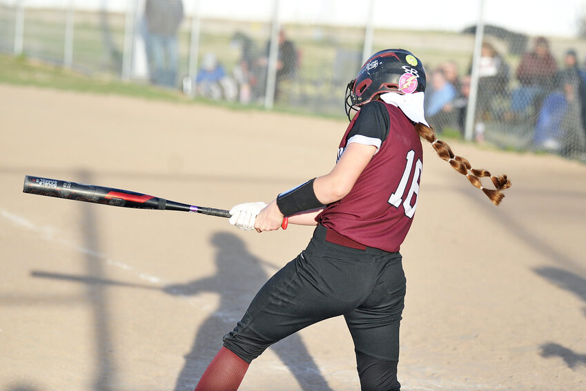 Freshman Shaylyn Wunder hits a triple into right field during the second game of the April 22 double-header against Wheatland. Wunder’s triple resulted in three RBI, narrowing Wheatland’s lead to a single run, 7-6, in the third inning.