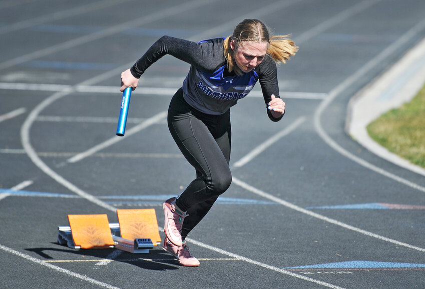 Senior Taylar Hansen, pictured above starting a relay in Bayard in April, clinched gold in the 100-meter hurdles at SEWAC, posting a time of 17.15 seconds.