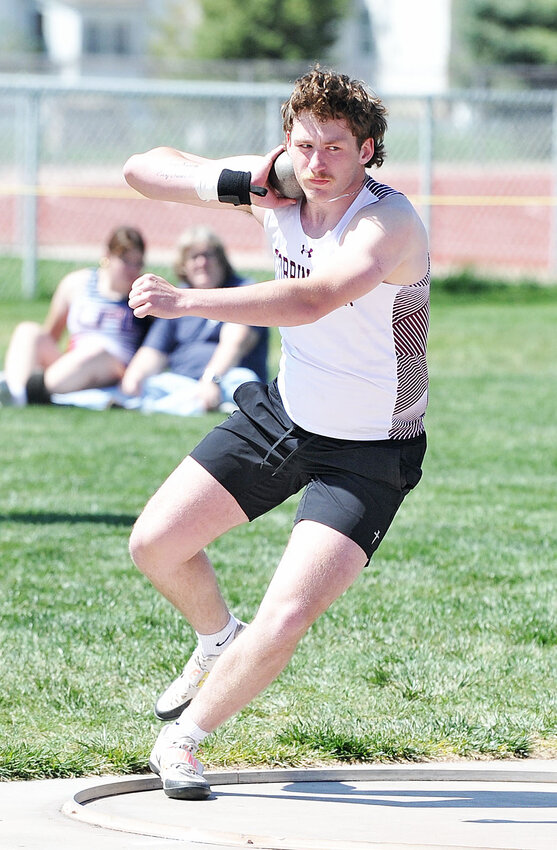 Senior Brayden Hime winds up for the shot put at the Wiseman Invitational on Friday, May 9. Hime captures second in the event.