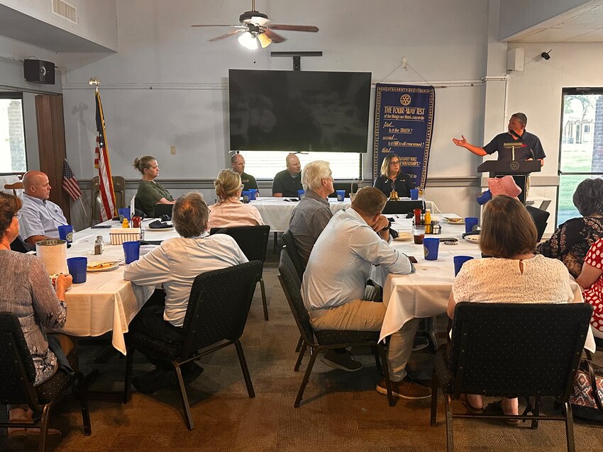 Mike Lashley, Lingle-Ft. Laramie Athletic Director introduced Susan Bartel, 1A Girls Basketball Coach of the Year (far left), Bradon Gifford, 1A Boys Wrestling Coach of the Year and Chris Cook, 1A Boys Basketball Coach of the Year to the Torrington Rotary Club. Also pictured is Michele Ogburn, Rotary president.