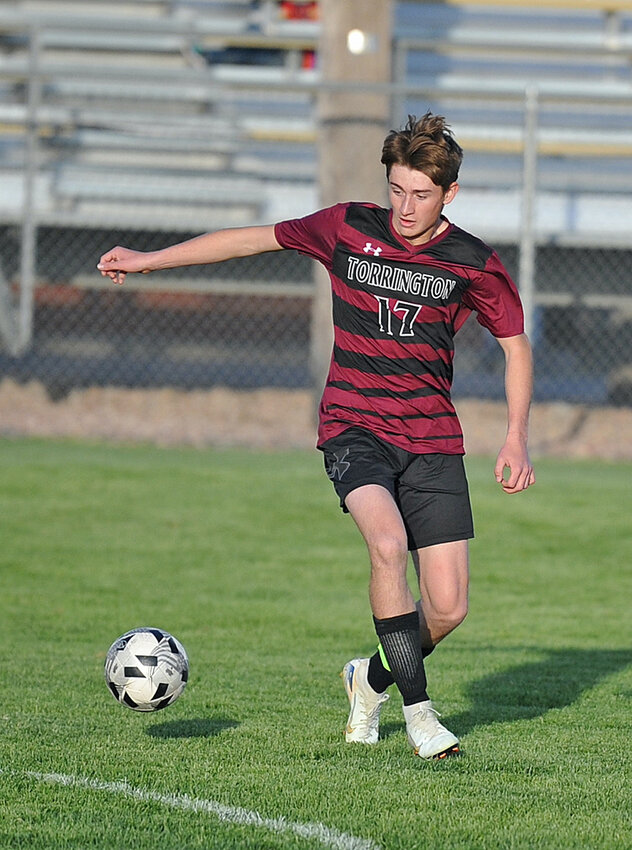 Senior Ayden Shimic dribbles the ball in Newcastle’s side of the field during the home game on Friday, May 16. Shimic scored one goal for the Blazers against the Dogies.