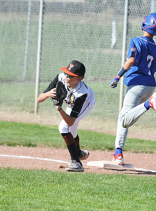 Out! Chase Moeller completes a double play at first base for the Tigers ‘C’ team in the first inning of the first game in a double-header on Tuesday, June 10. Torrington defeated Douglas in both games, 14-0 and 19-2.