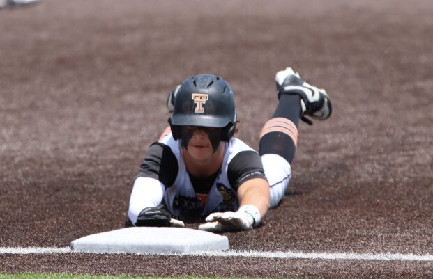 Safe! Drew Kramer slides into a base during a game at a tournament in Cheyenne in May. Kramer scored two runs for the Tigers in the second game of a double-header against Wheatland on Tuesday, June 17, including a run scored on an error by Wheatland after stealing second and third bases in the first inning.