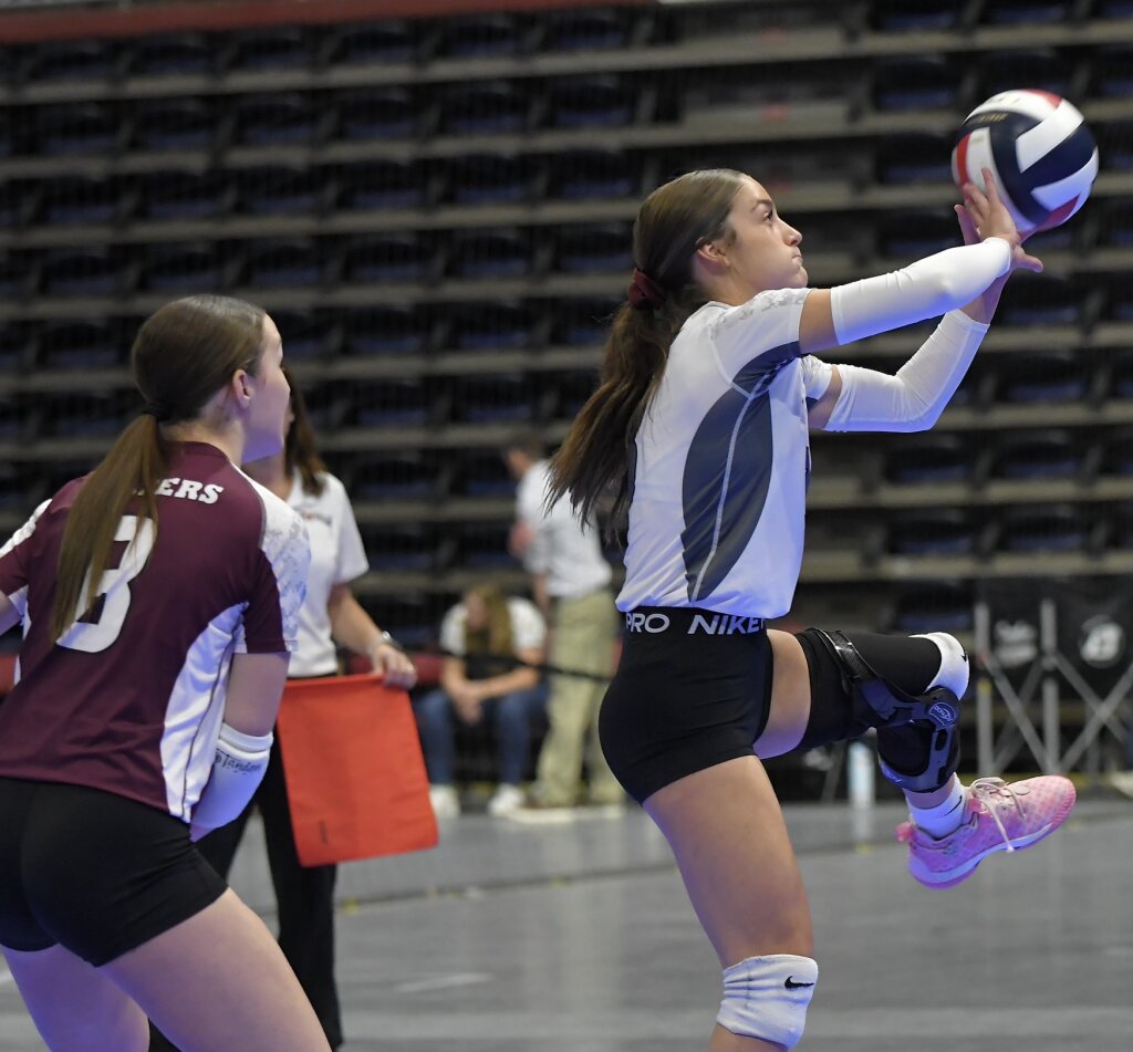 Torrington's Jaycee Hurley (right) passes the ball in action against Powell Thursday in first round action of the 3A Wyoming State Volleyball Championships while teammate Olive Osmera looks on. Andrew Towne/Torrington Telegram